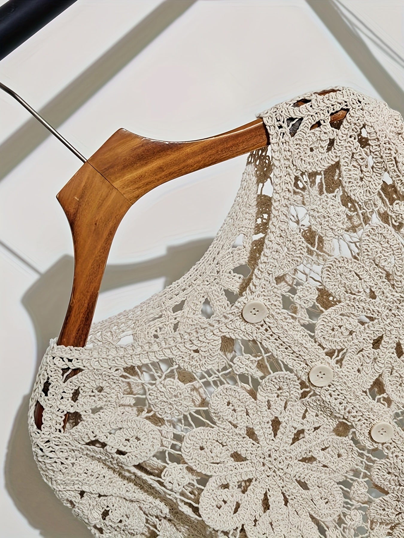 This Artistic Jacquard Cardigan Features Crocheted Openwork That Illustrates a Fanciful Paradise. Detailed Embroidery That Looks Like Vines Surrounds The Hem