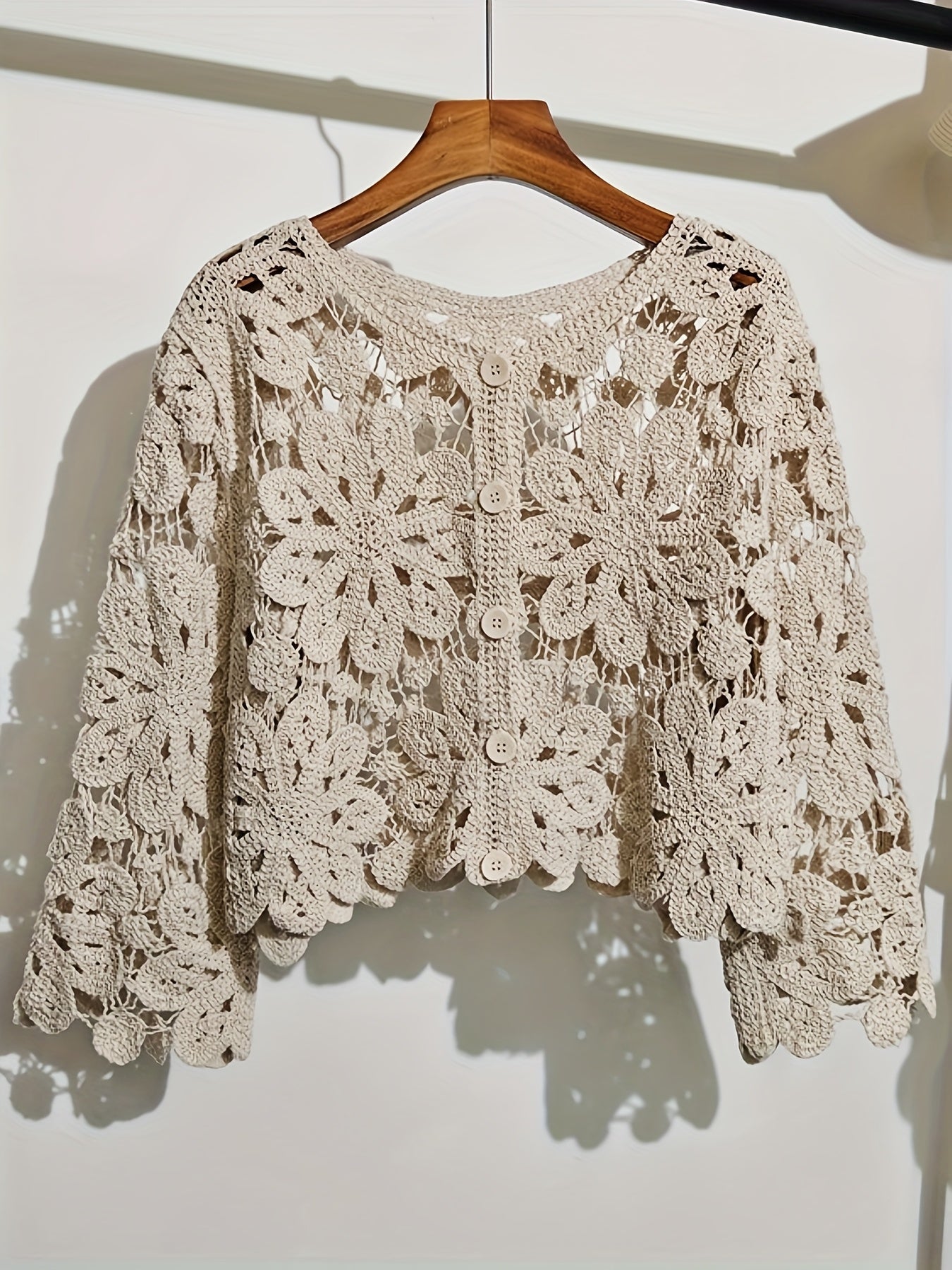 This Artistic Jacquard Cardigan Features Crocheted Openwork That Illustrates a Fanciful Paradise. Detailed Embroidery That Looks Like Vines Surrounds The Hem
